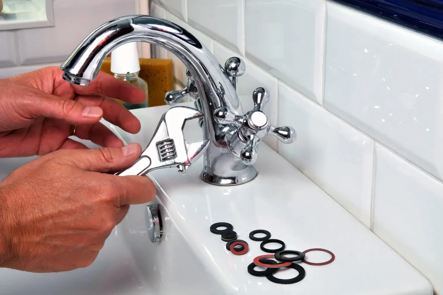 Plumber maintaining a bathroom faucet in Saratoga