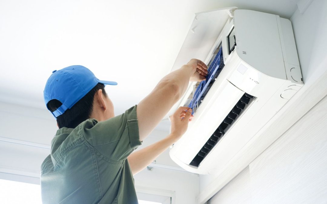 HVAC technician servicing a ductless mini split in Saratoga
