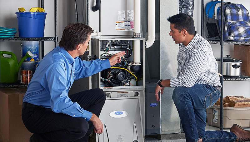 Technician evaluating a furnace for repair or replacement in Saratoga