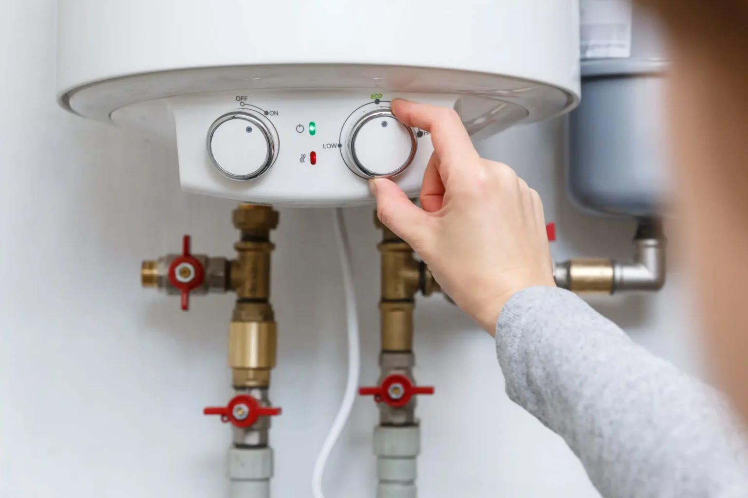 Technician adjusting a water heater in Saratoga